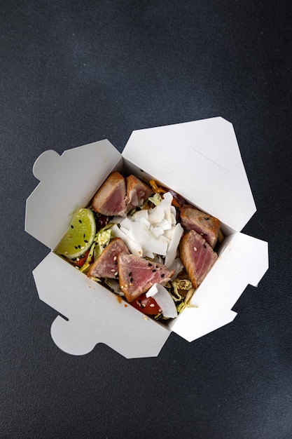 Delicious wok noodles box container. Chinese and asian takeaway fast food.