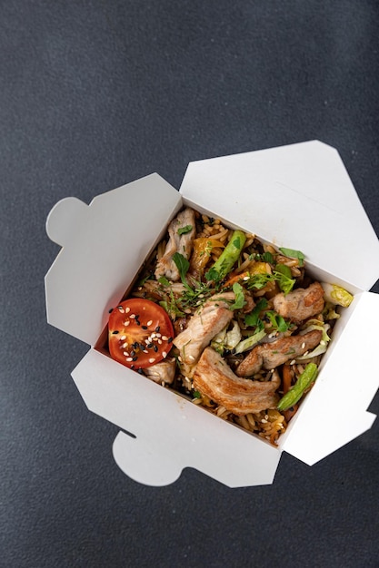 Delicious wok noodles box container. Chinese and asian takeaway fast food.