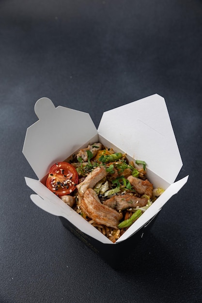 Delicious wok noodles box container. Chinese and asian takeaway fast food.