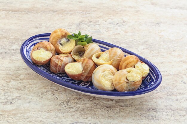 Delicous baked snail with butter and garlic Escargot