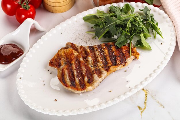 Delicous grilled pork meat steak with sauce