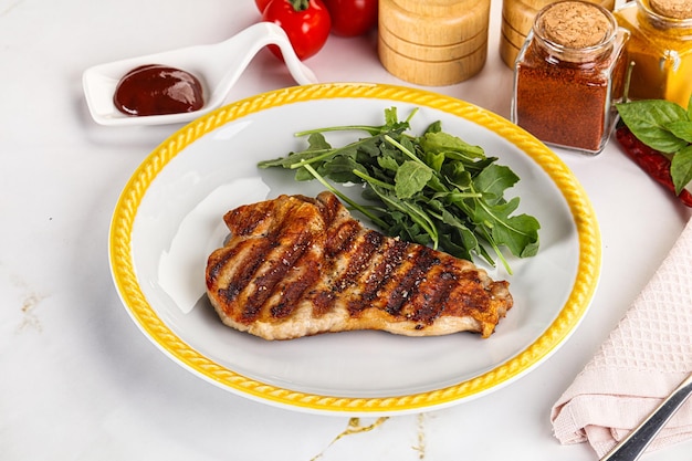 Delicous grilled pork meat steak with sauce