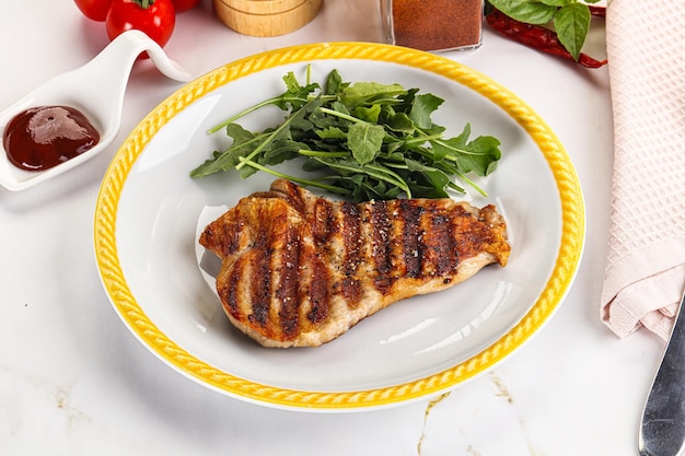 Delicous grilled pork meat steak with sauce