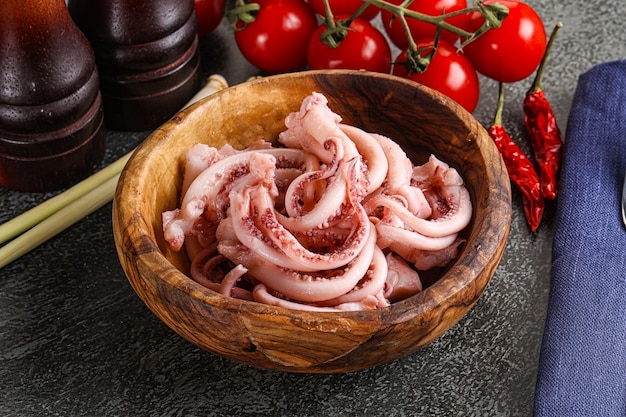 Delicous marinated squid tentacles snack in the bowl