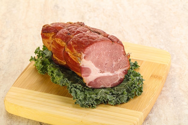 Delicous pork cured meat isolated over board