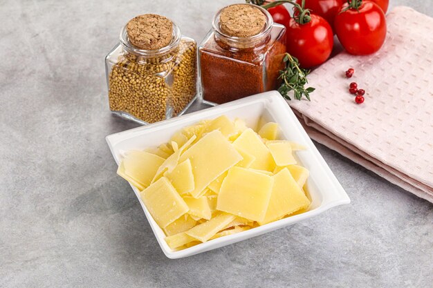 Delicous Sliced parmesan cheese in the bowl