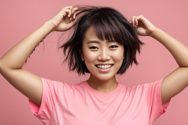 Delighted asian woman with raised arms and cheerful smile in city