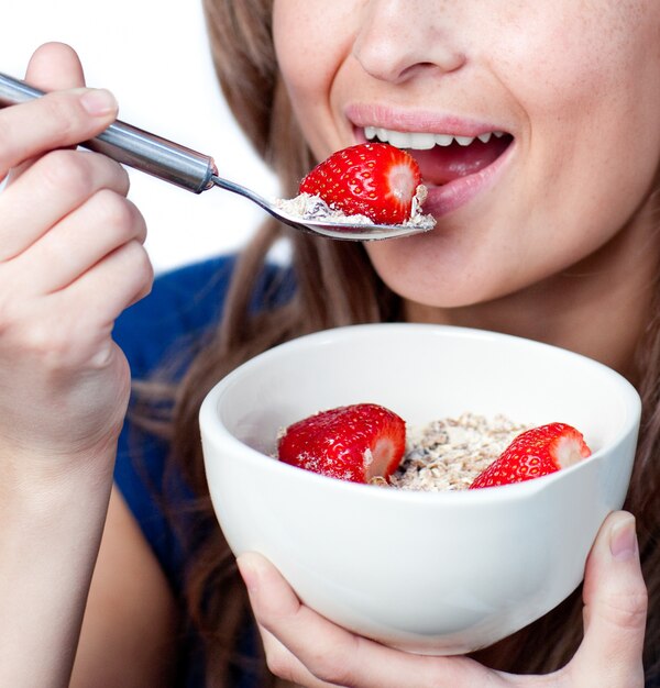 Delighted woman having a healthy breakfast 