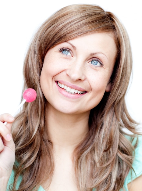 Delighted woman holding a lollipop 