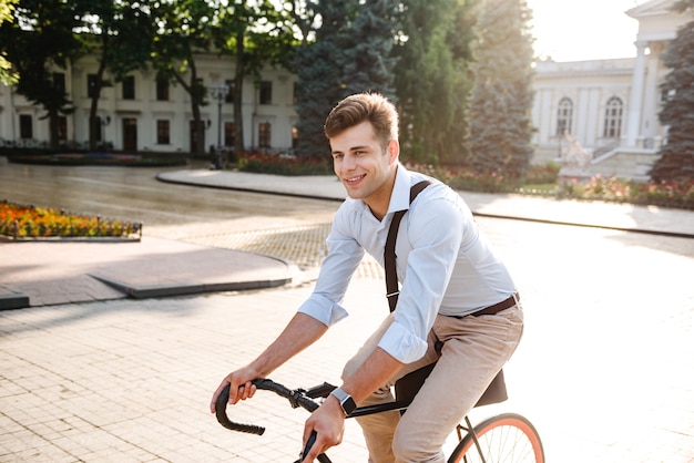 Delighted young stylish man dressed in shirt