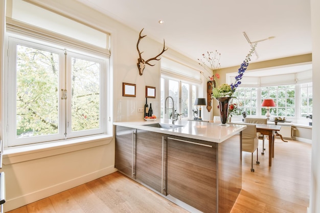 Delightful kitchen area with hardwood floor and brown kitchen unit