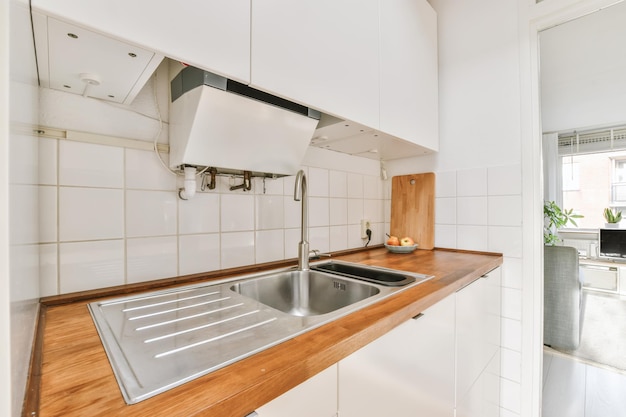 A delightful little kitchen with a wooden countertop