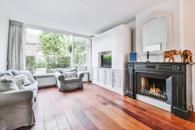 A delightful living room with a gray sofa and a large window