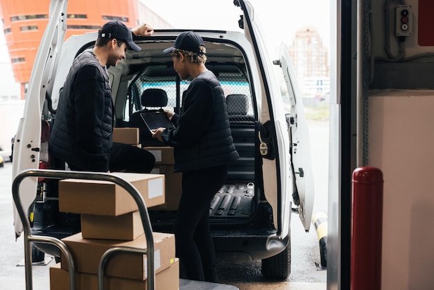 deliver persons holding parcel at van