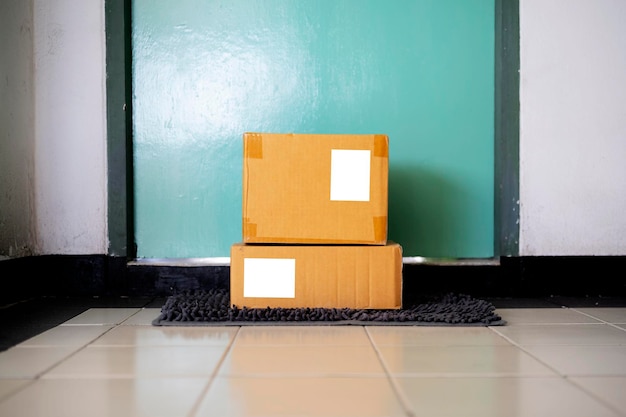 Delivered parcels on door mat near entrance