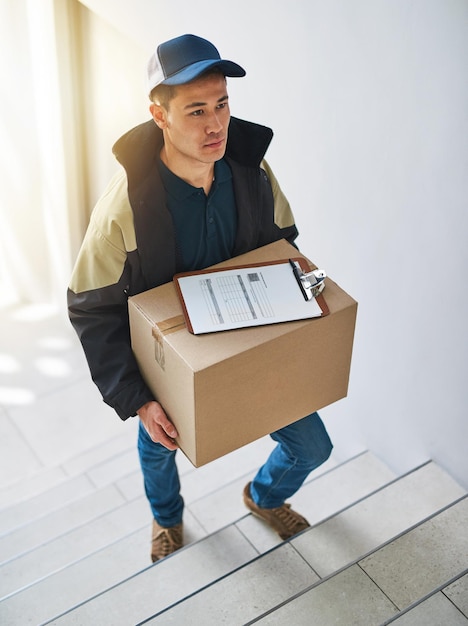 Deliveries done right on time all the time Shot of a courier making a delivery in an office