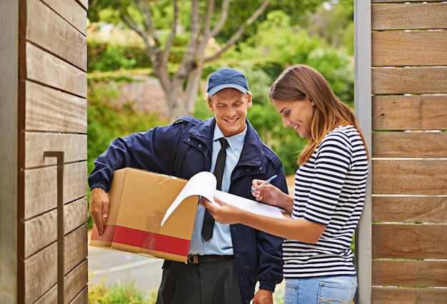 Delivering each package with a smile Shot of a male courier delivering a package to a woman at her home