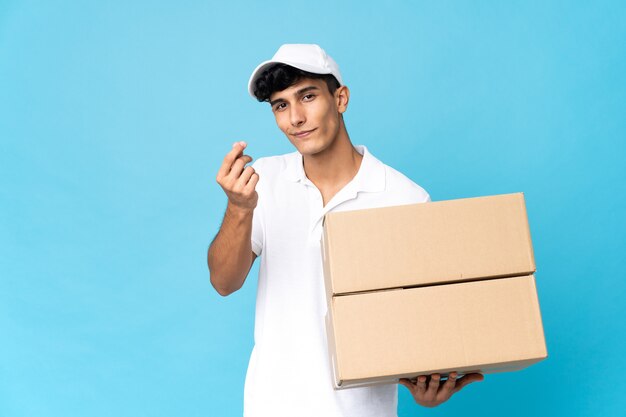 Delivery Argentinian man isolated making money gesture