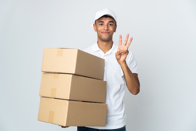 Delivery Brazilian man isolated on white background happy and counting three with fingers