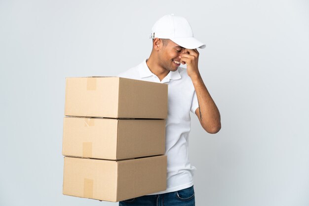 Delivery Brazilian man isolated on white background laughing