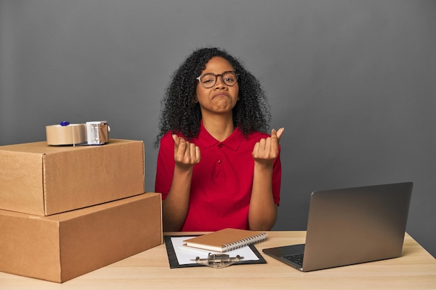 Delivery businesswoman with inventory and boxes showing that she has no money