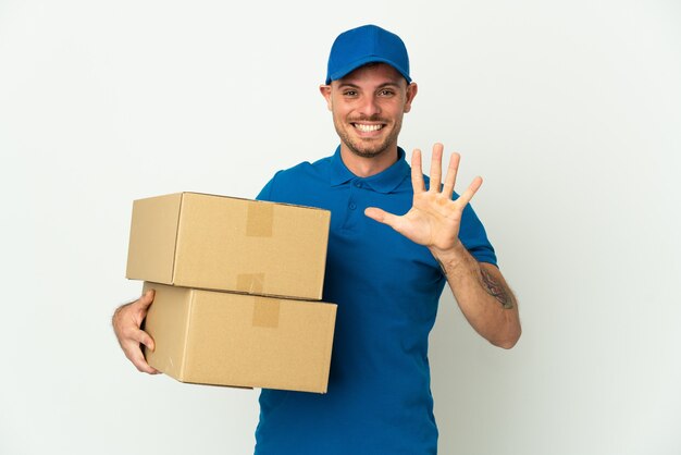 Delivery caucasian man isolated on white background counting five with fingers