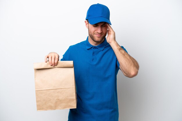 Delivery caucasian man isolated on white background with headache