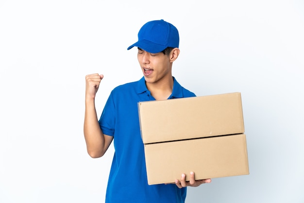 Delivery Chinese man isolated on white space celebrating a victory