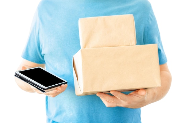 Delivery concept  deliveryman with tablet and boxes isolated on white