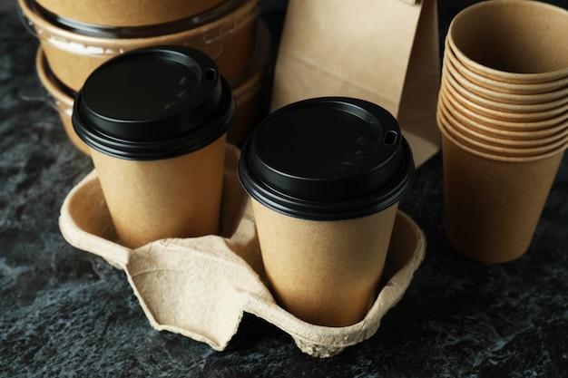 Delivery containers for takeaway food on black smokey table