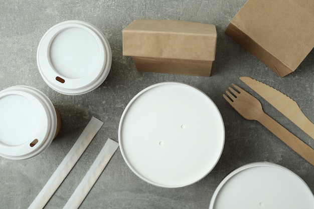 Photo delivery containers for takeaway food on gray textured table