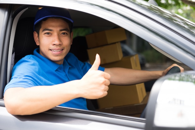 Photo delivery driver driving car with packages