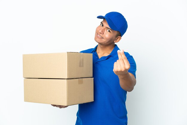 Delivery Ecuadorian man isolated on white background making money gesture