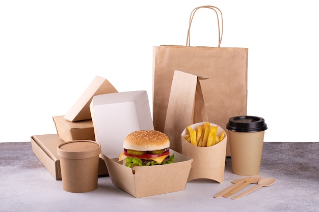 Delivery food eco packaging with burger and french fries, coffee. Fast food