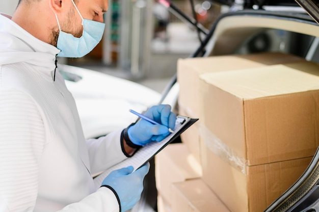 Photo delivery guy checking online order