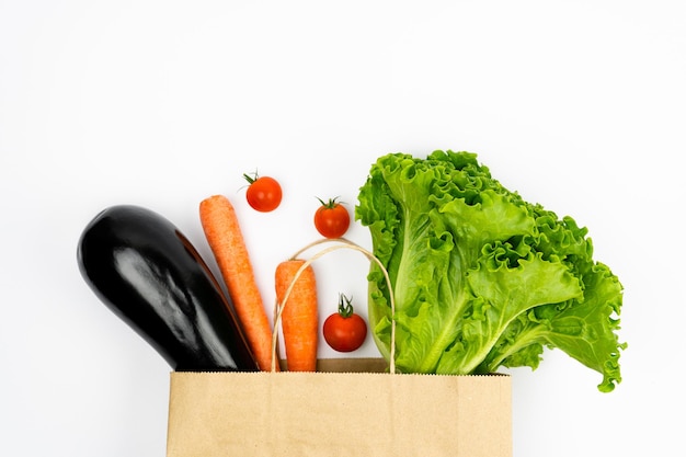 Delivery healthy food Healthy vegan vegetarian food in paper bag vegetables and fruits on white