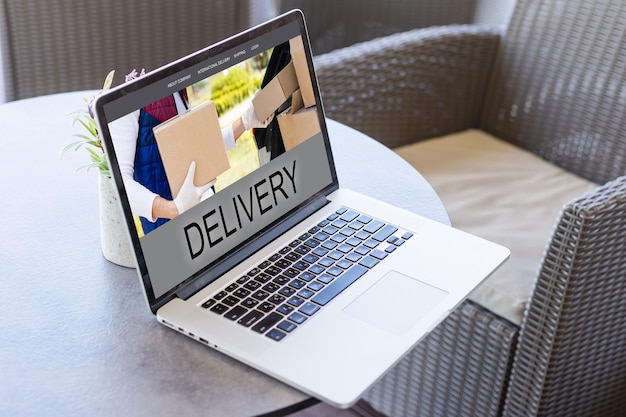 delivery icon on laptop keyboard. Online shopping, ecommerce and retail sale concept, delivery for customers ordering things from retailers websites using internet.