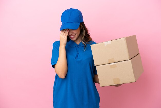 Delivery Italian woman isolated on pink background laughing