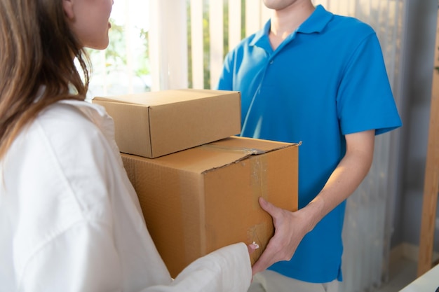 The delivery man brings the goods that the customer purchased and delivers them to the customer