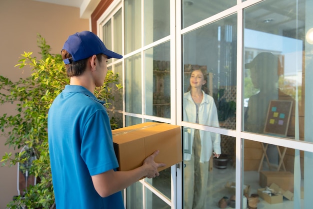 The delivery man brings the goods that the customer purchased and delivers them to the customer