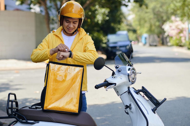 Photo delivery man checking notifications on smartwatch