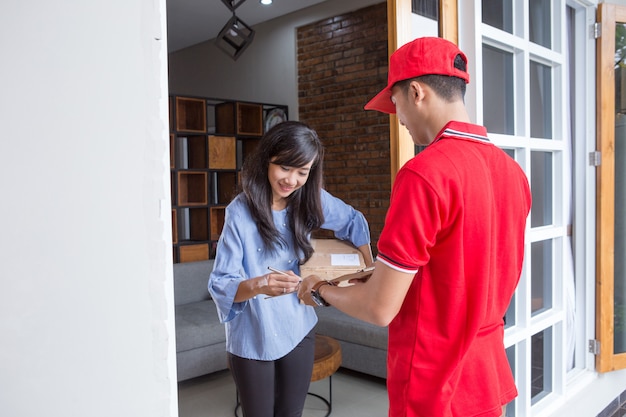 Photo delivery man delivering box