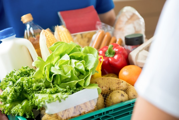 Delivery man delivering food to customer at home