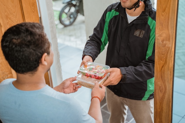 Delivery man delivering grocery