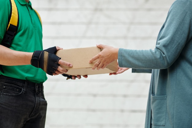 Delivery Man Giving Food to Customer