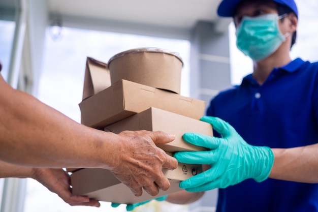 Delivery man giving the package to a man