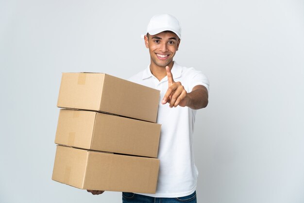 Delivery man isolated showing and lifting a finger