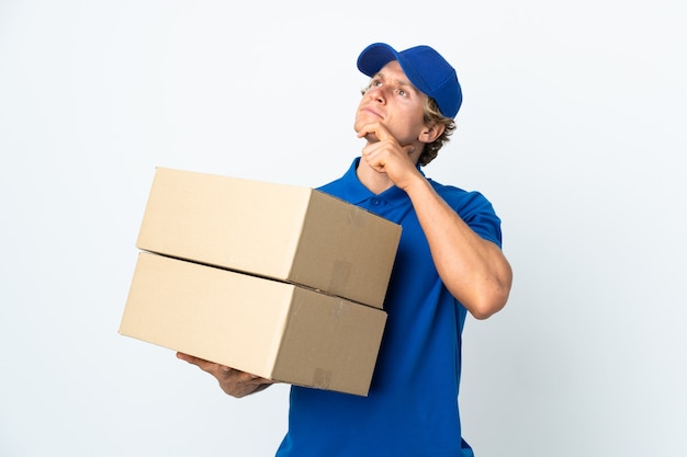 Delivery man on isolated white having doubts