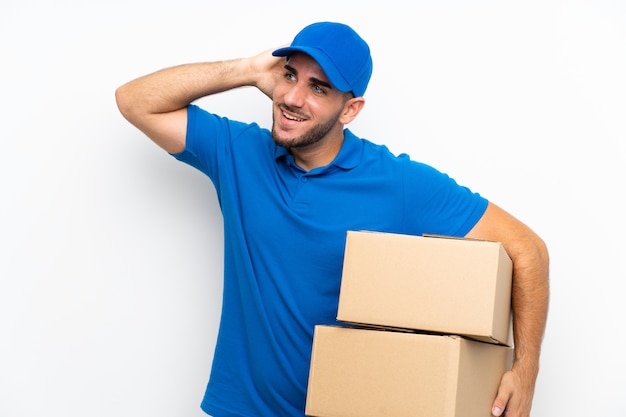 Delivery man over isolated white laughing