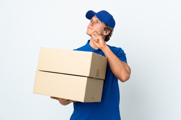 Photo delivery man on isolated white and looking up